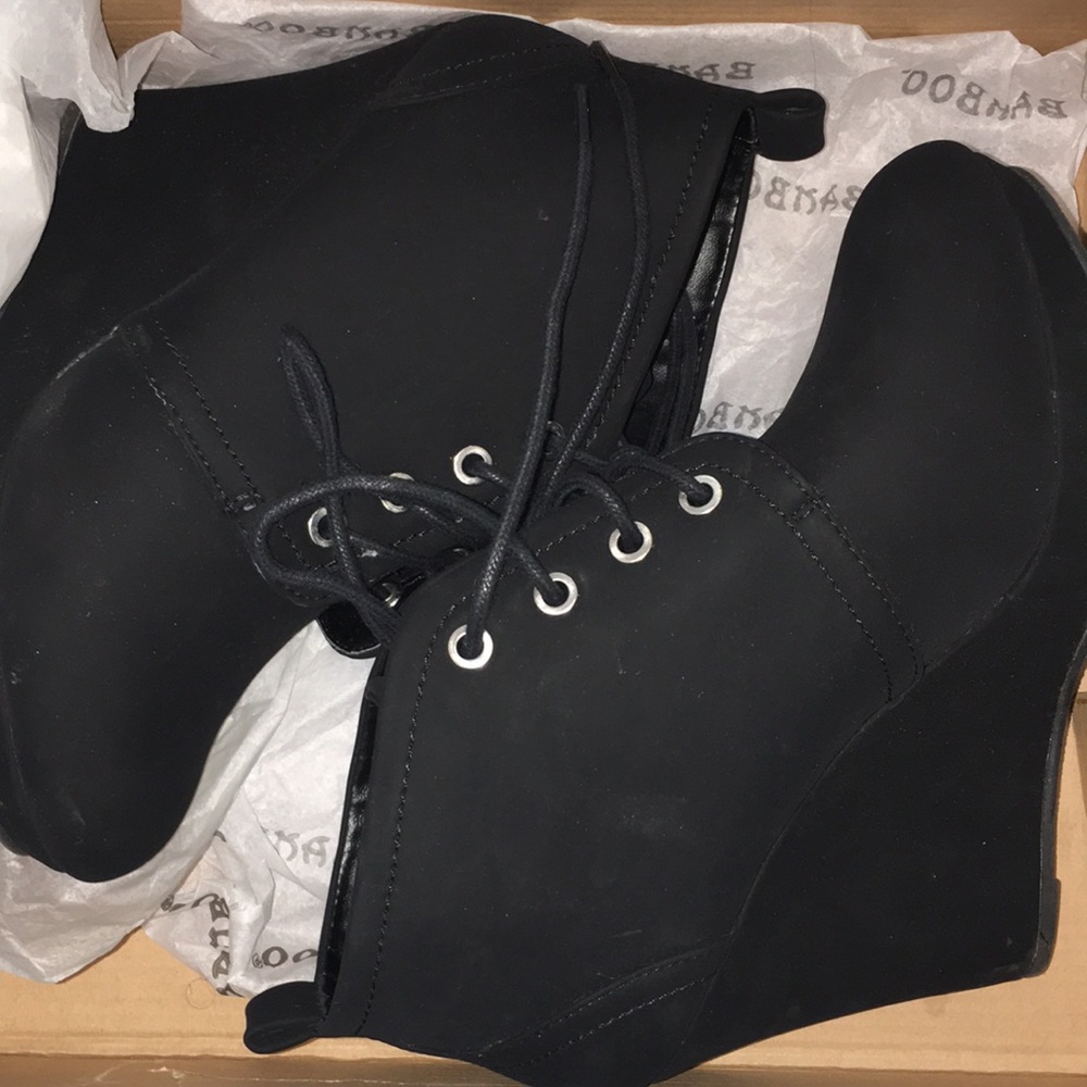 Black wedge boots